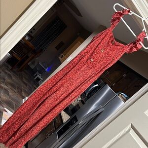 Girls jump suit in orange with red flowers